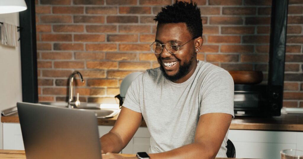 a man looking at his laptop while being engage at something