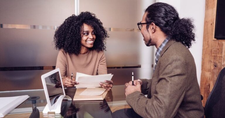 a woman interviewing a man for a job